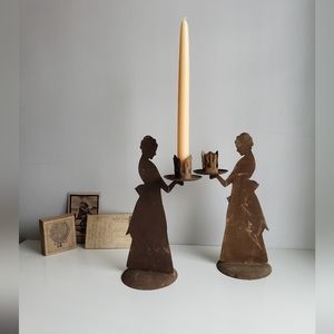 Metal candlestick holders with rustic patina